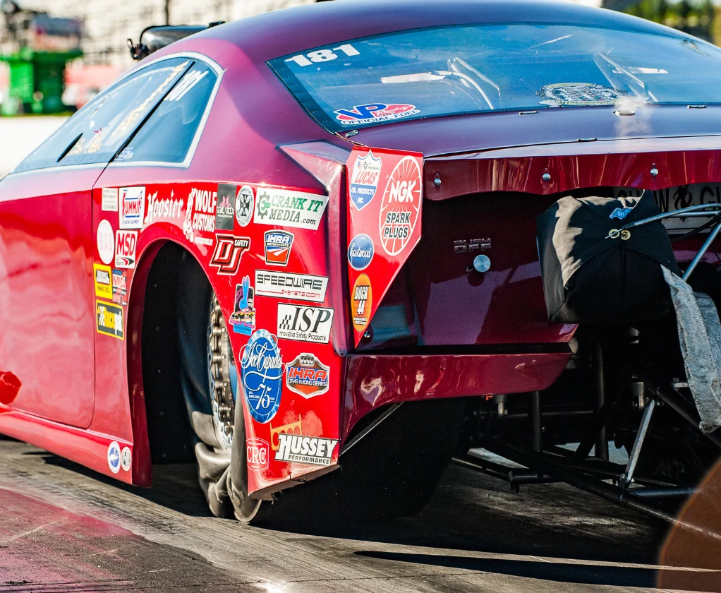 Rear three-quarter view of Stella, the red Cadillac CTS-V Pro Mod, on the starting line